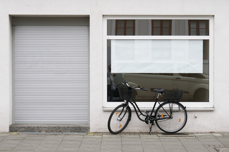 blank vacancy sign with copy space in empty shop or store window blank vacancy sign or poster with copy space in empty store window with bicycle parked outside closed shop